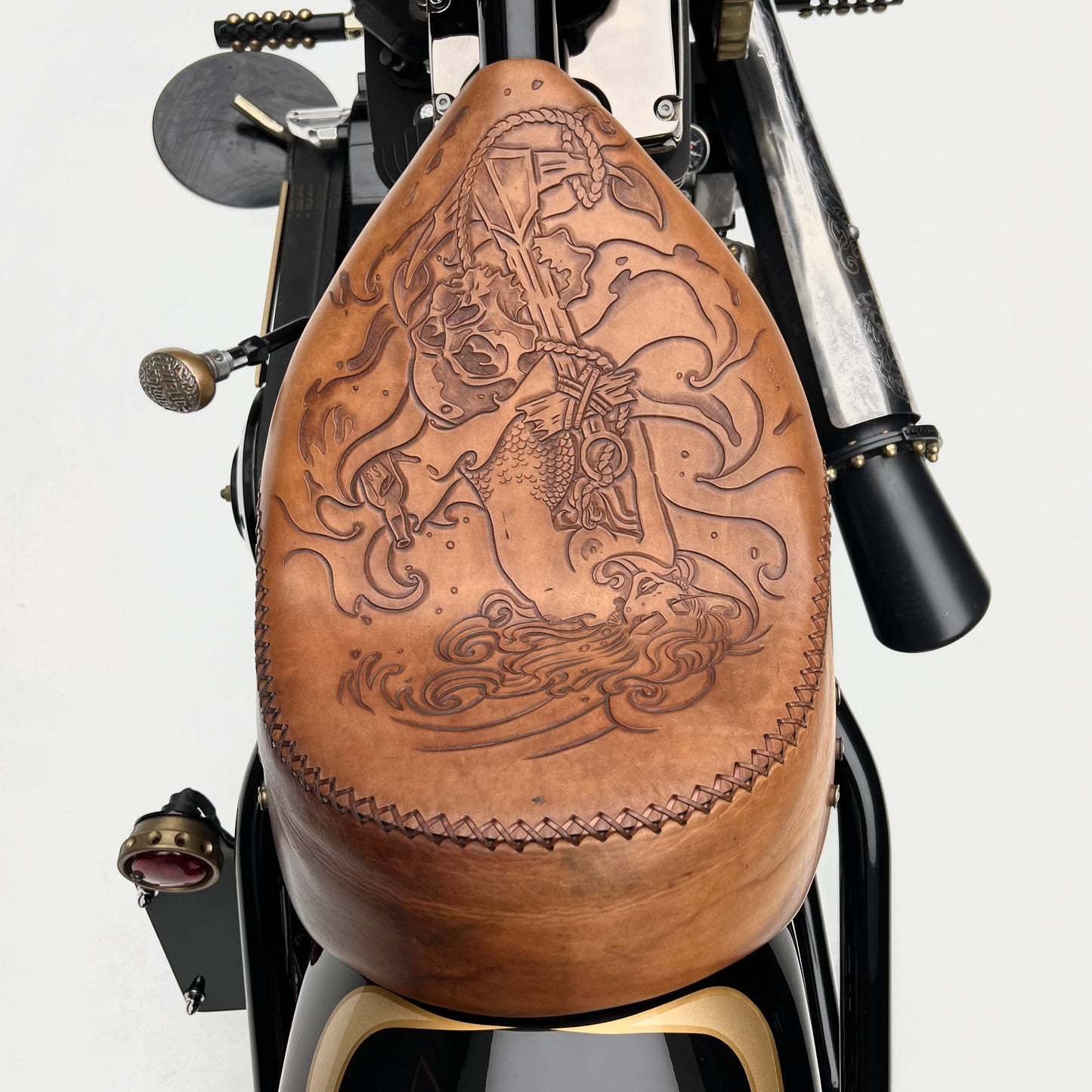 A close-up of a 2011 custom chopper's gleaming chrome engine and handlebars, with intricate detailing that showcases the craftsmanship.
